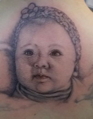 Tatouage portrait d'un bébé