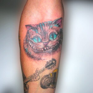 Tatouage Chat du Cheshire d'Alice au pays des merveilles